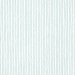 Detail of fabric in a wiggly stripe print in light turquoise on a white field.