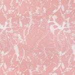 Detail of fabric in a branch and blossom print in cream and pink on a pink field.