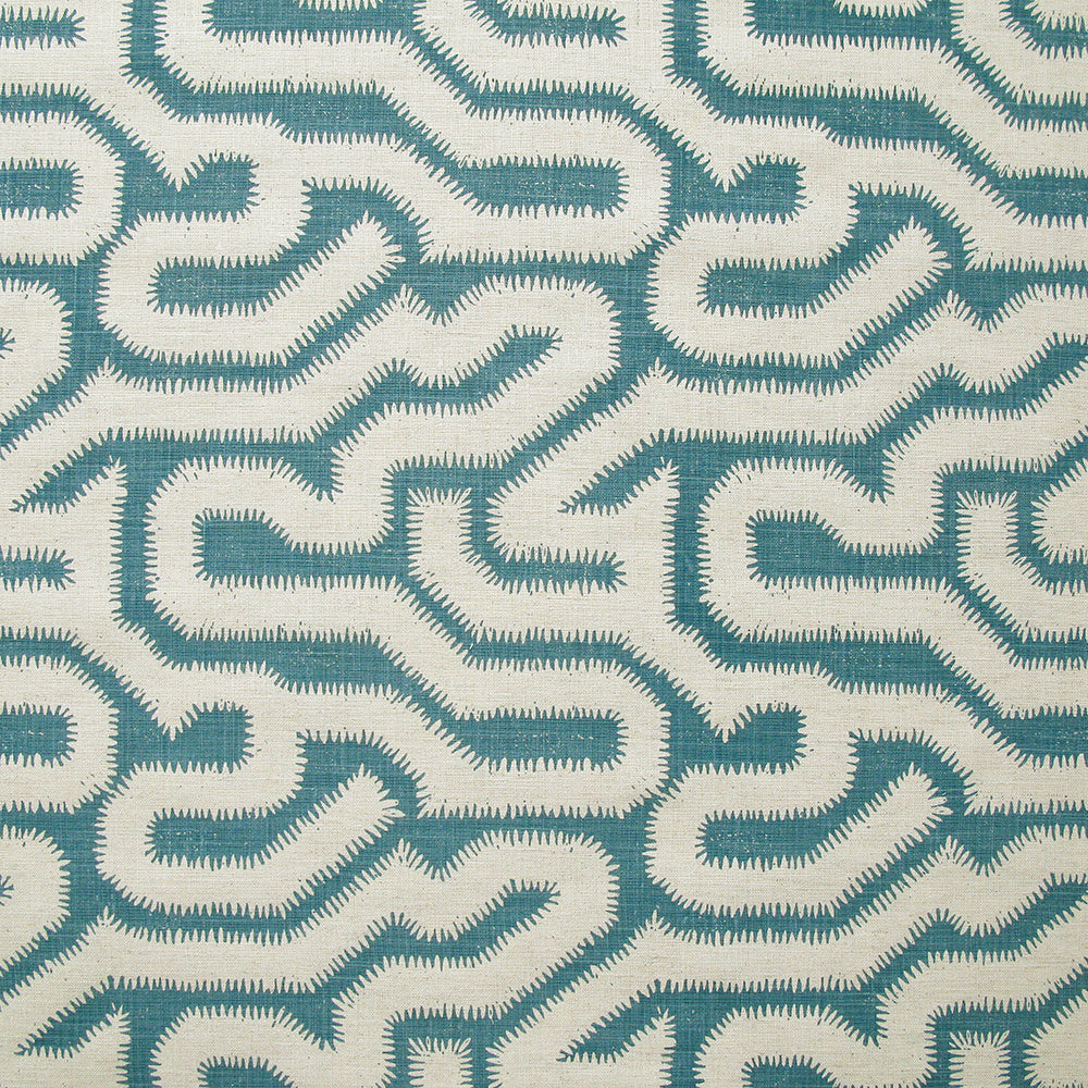Detail of fabric in a playful meandering print in cream on a blue field.