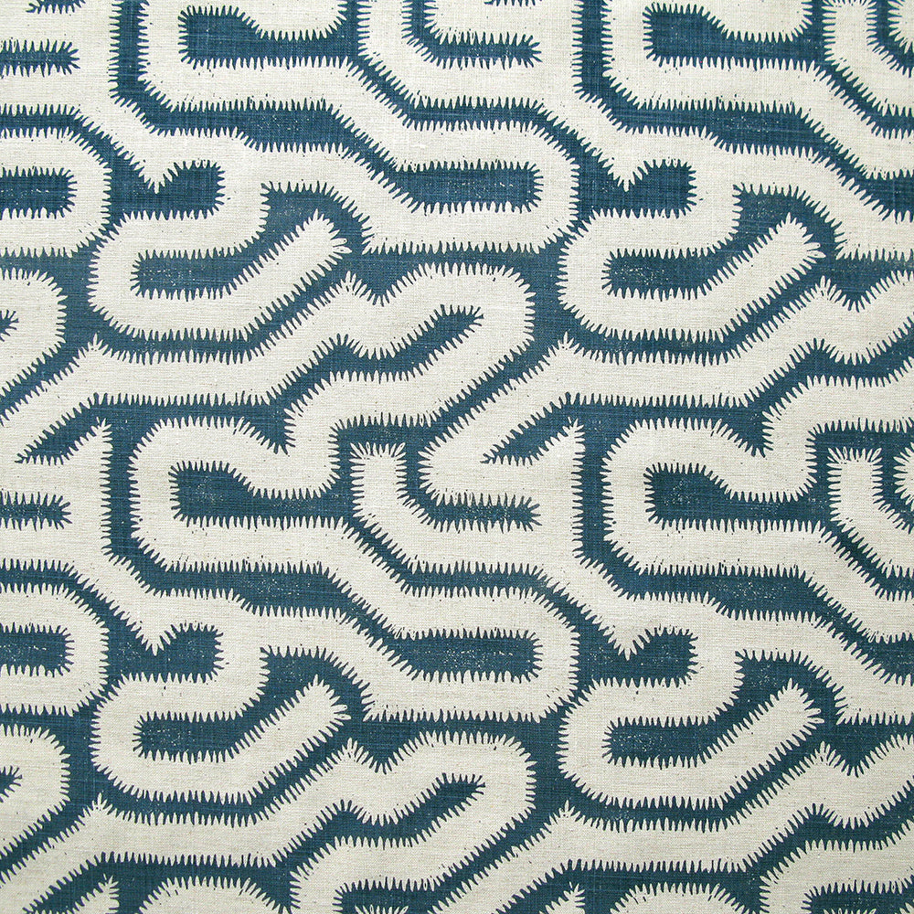 Detail of fabric in a playful meandering print in cream on a navy field.