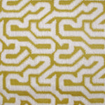 Detail of wallpaper in a playful meandering print in white on a mustard field.