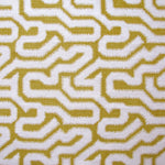 Detail of fabric in a playful meandering print in cream on a mustard field.