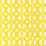 Detail of fabric in an intricate lattice print in yellow on a cream field.