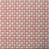 Detail of wallpaper in a floral grid print in white on a red field.