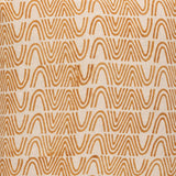 Detail of fabric in an abstract curvilinear stripe in orange on a tan field.