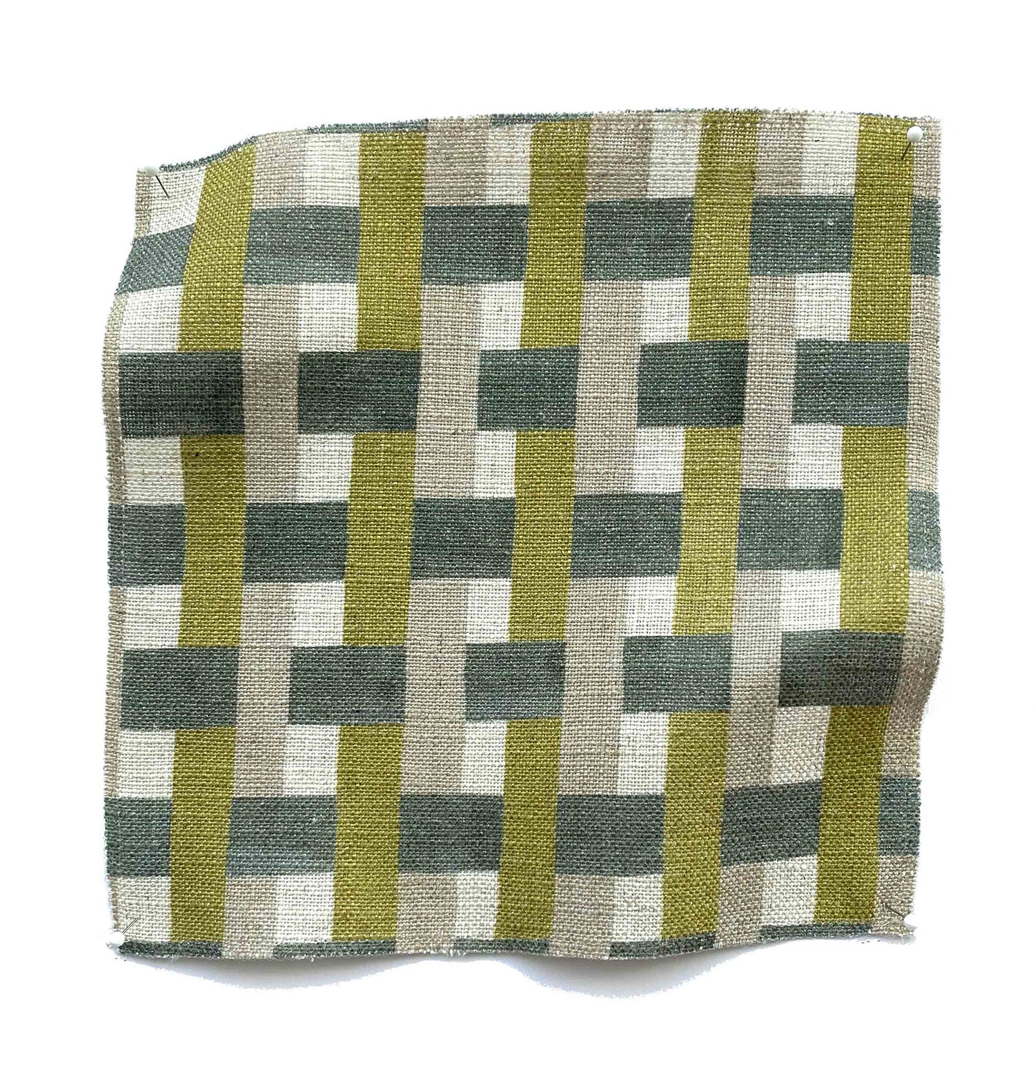 Square fabric swatch in an interlocking checked pattern in shades of tan, lime and green.