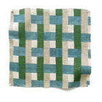 Square fabric swatch in an interlocking checked pattern in shades of tan, blue and green.