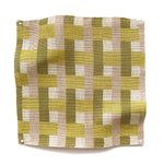 Square fabric swatch in an interlocking checked pattern in shades of pink, yellow and sage.