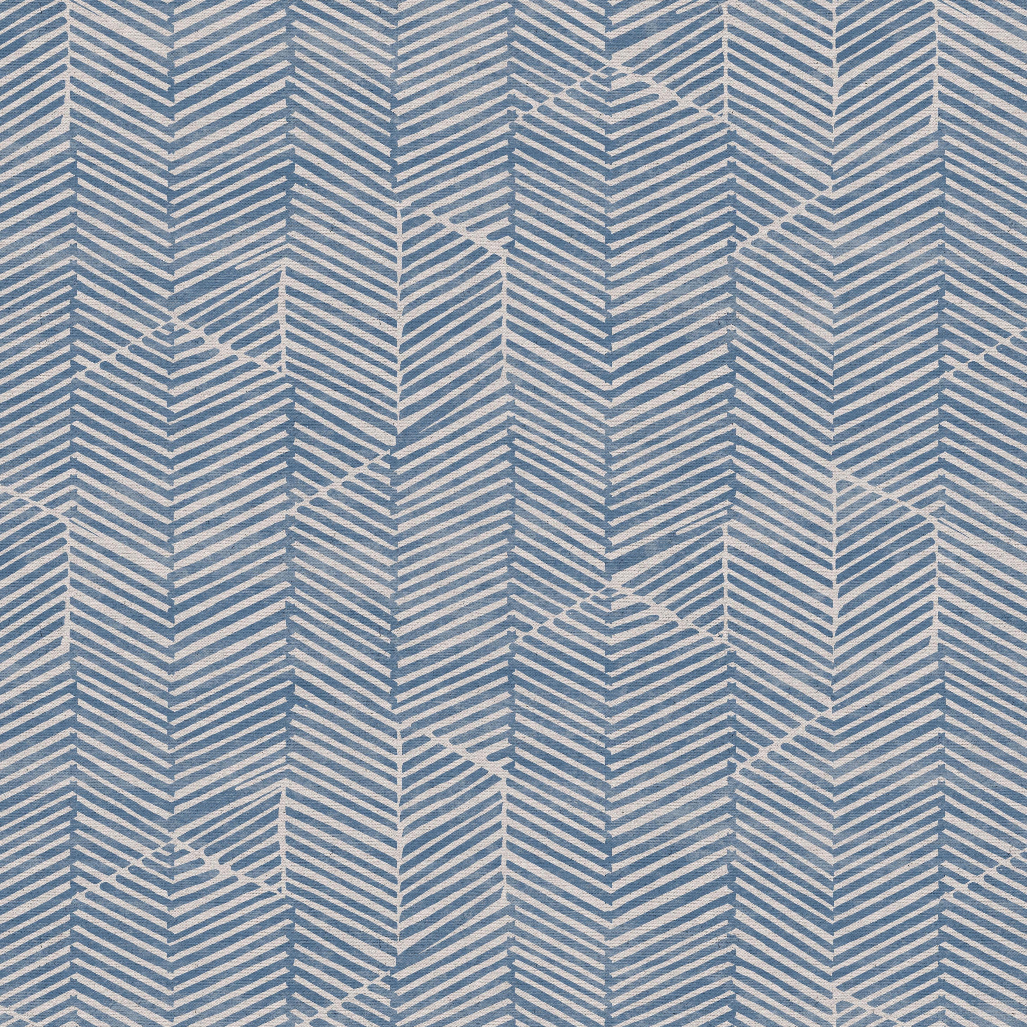 Detail of fabric in a dense herringbone print in dusty blue on a tan field.