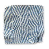 Square fabric swatch in a dense herringbone print in dusty blue on a tan field.