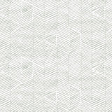 Detail of fabric in a dense herringbone print in light gray on a white field.