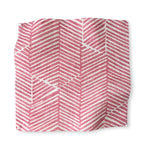 Square fabric swatch in a dense herringbone print in rose on a tan field.