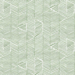 Detail of fabric in a dense herringbone print in sage on a white field.