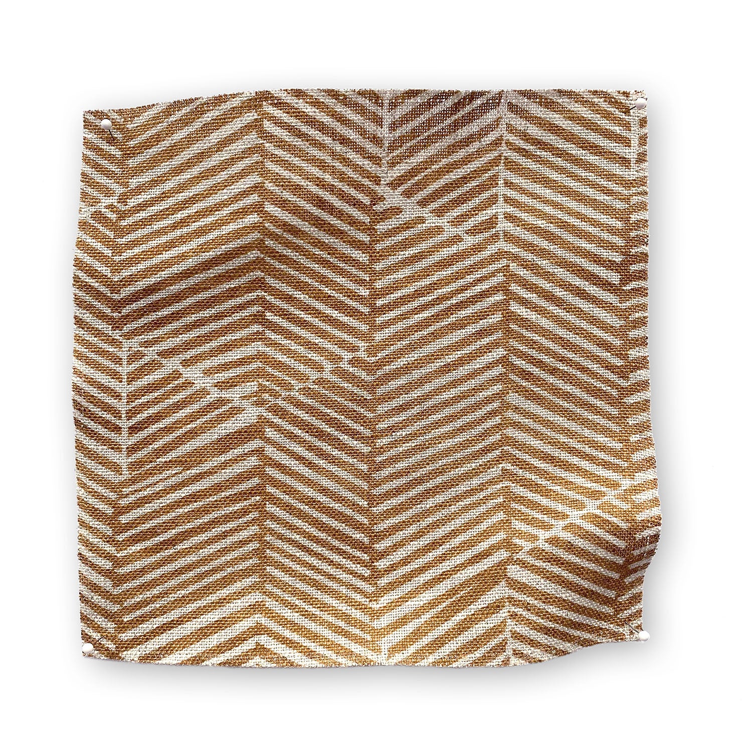Square fabric swatch in a dense herringbone print in sienna on a tan field.