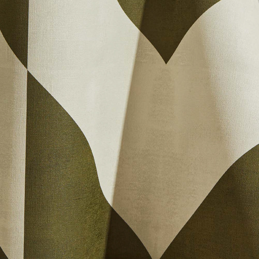 Draped wallpaper yardage in a large-scale geometric print in olive on a cream field.