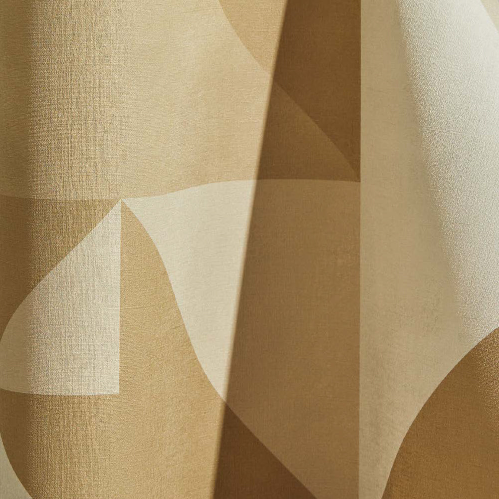 Draped wallpaper yardage in a large-scale geometric print in cream and tan.