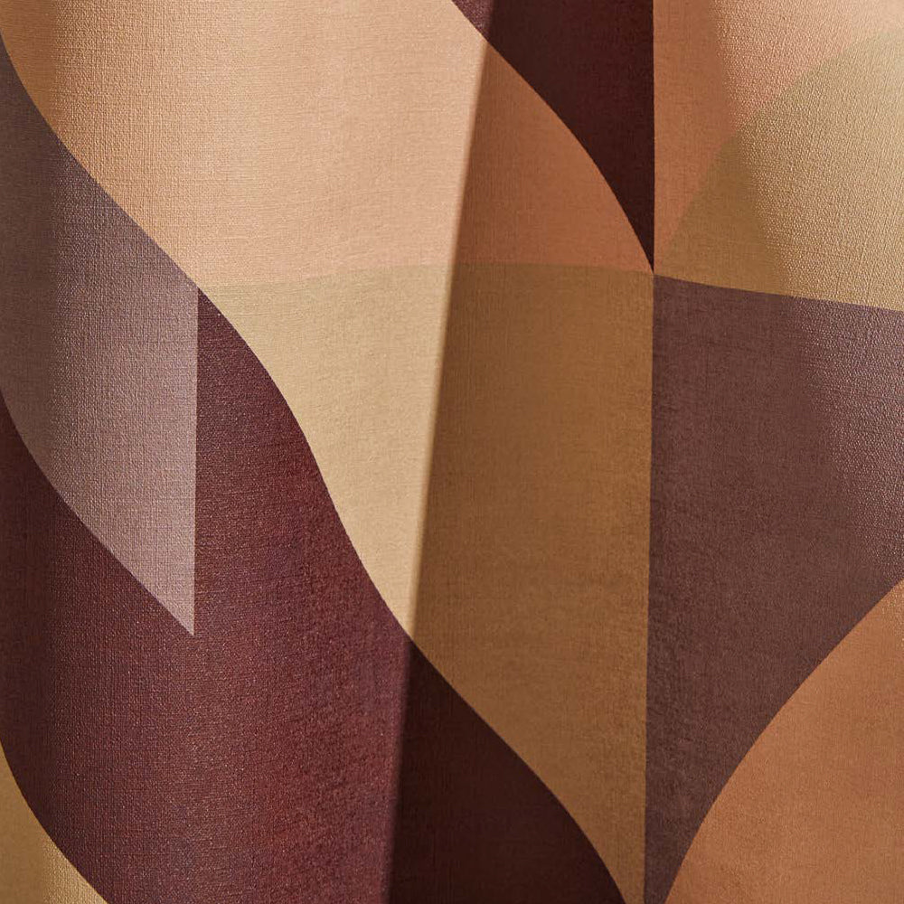 Draped wallpaper yardage in a large-scale geometric print in cream, brown and purple.