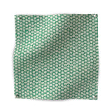 Square fabric swatch showing the reverse side of a dense checked weave in green and white.