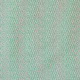 Detail of the reverse side of fabric in a dense checked weave in green and white.