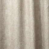 Draped linen in a painterly small-scale dashed dot print in white on a soft taupe watercolor field.