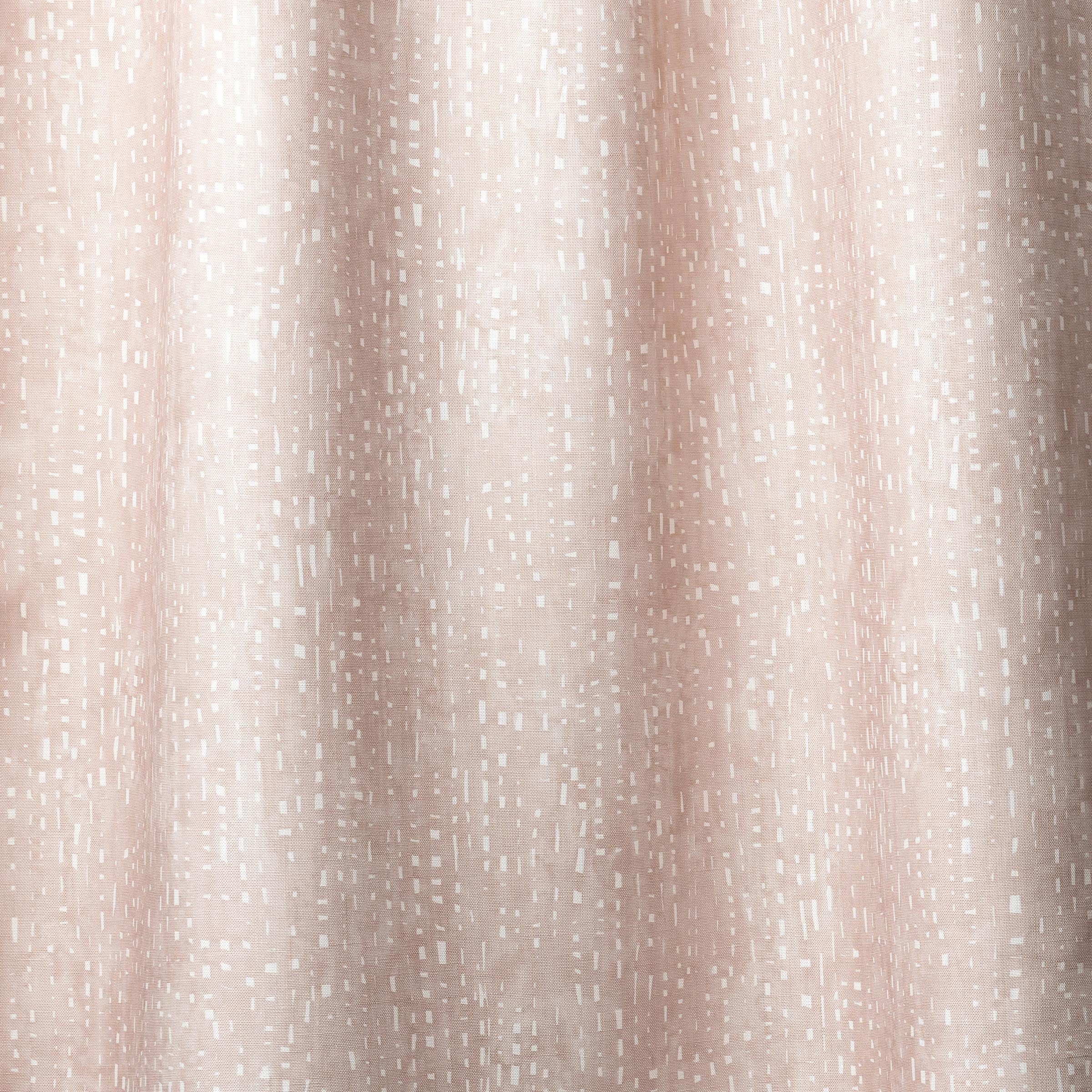 Draped linen in a painterly small-scale dashed dot print in white on a soft pink watercolor field.