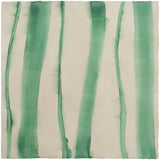 Sheet of hand-painted wallpaper with an irregular combed stripe pattern in emerald on a beige field.