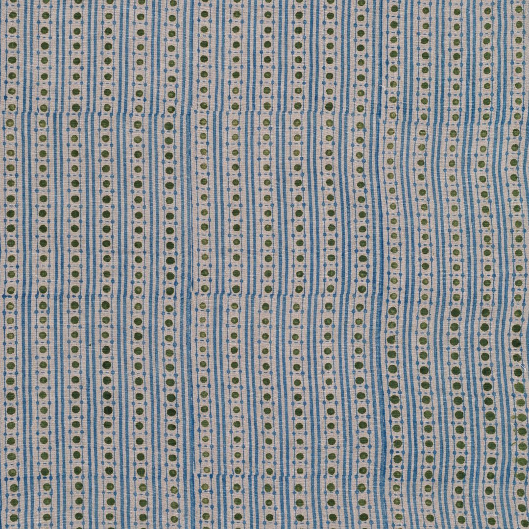 Detail of fabric in a geometric striped print in green and blue on a tan field.