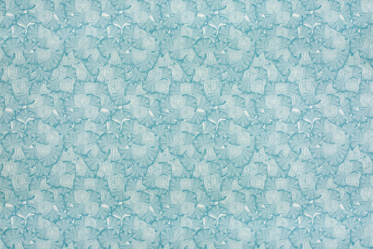 Detail of fabric in a dense petal print in shades of blue on a white field.