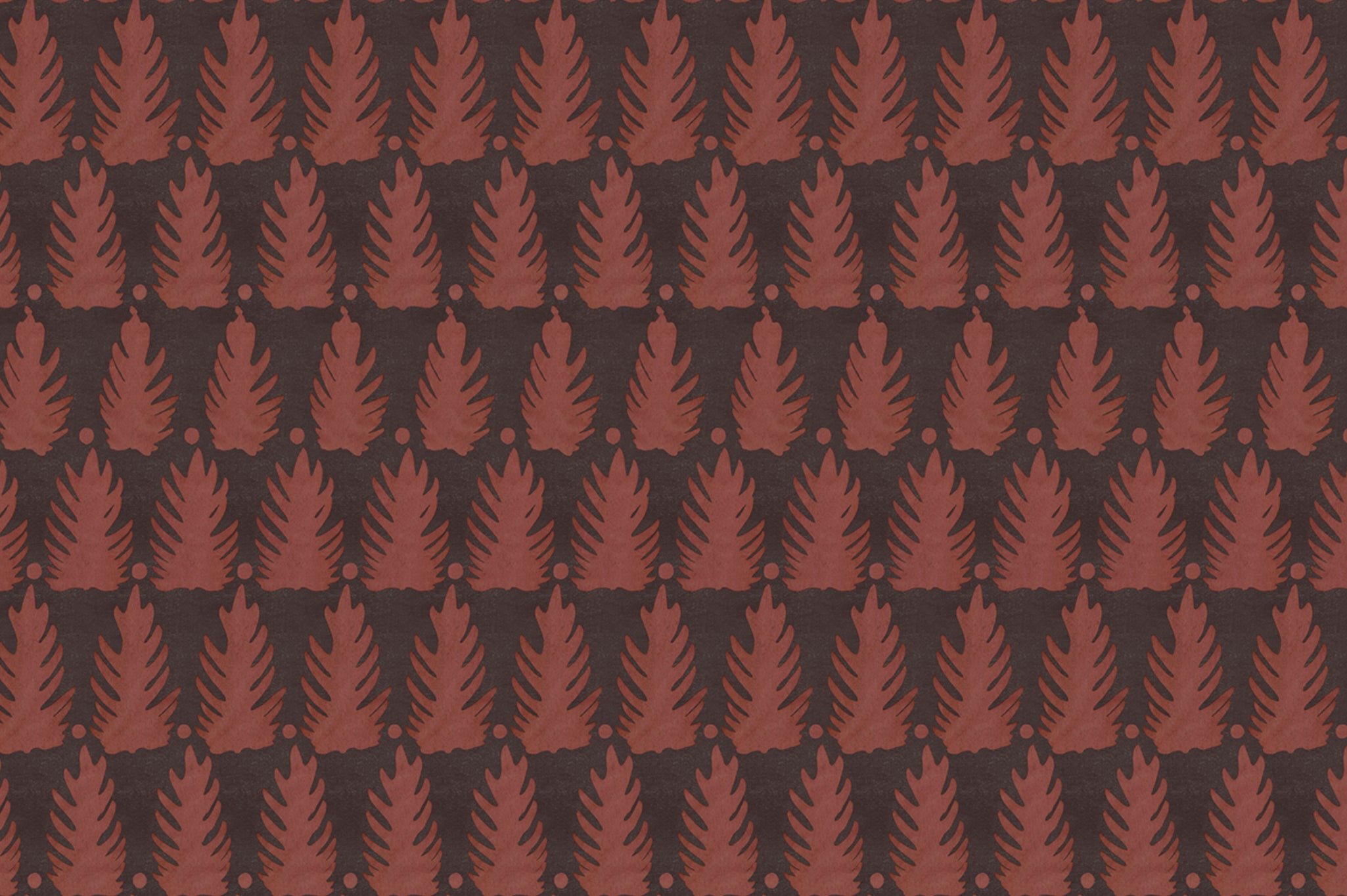 Detail of fabric in a linear leaf print in red on a black field.