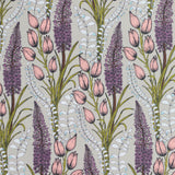 Detail of wallpaper in a dense foxtail and lilly print in pink, purple, green and white on a taupe field.