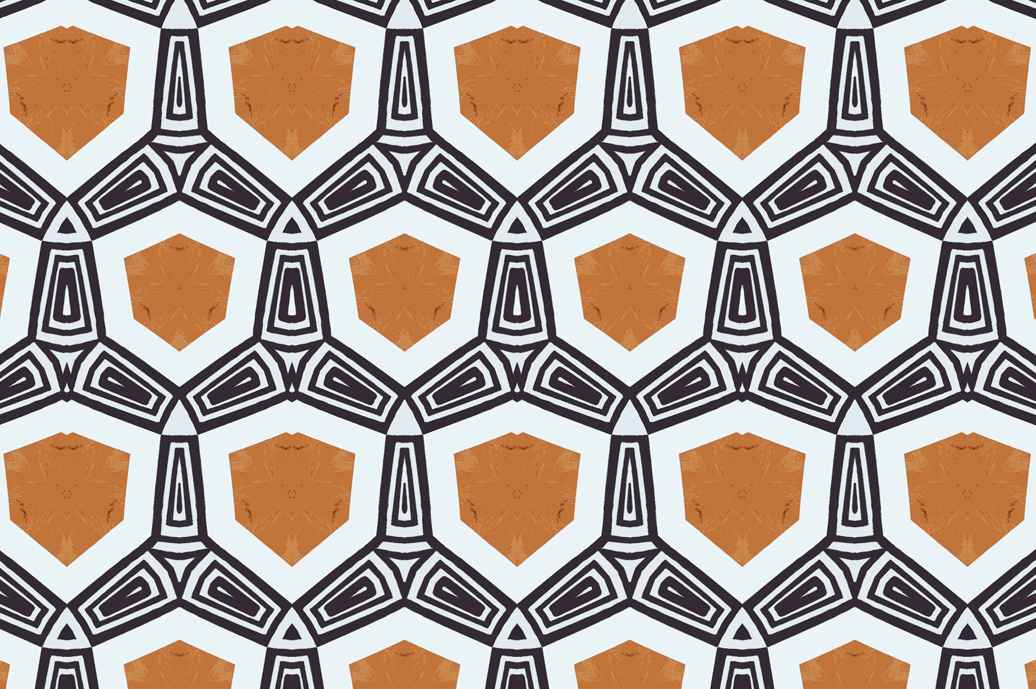 Detail of fabric in a geometric tribal print in shades of gold and black on a white field.