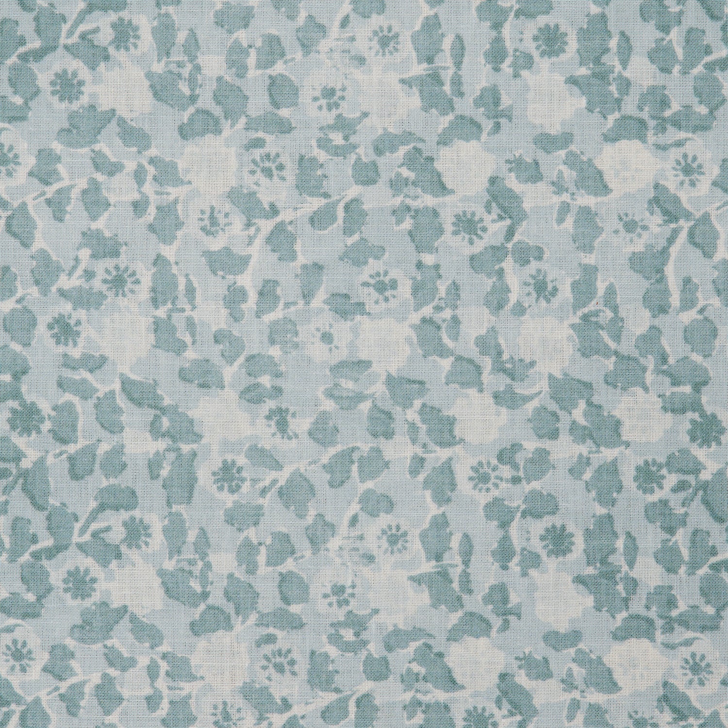 Detail of a linen fabric in a painterly floral pattern in shades of blue on a cream field.