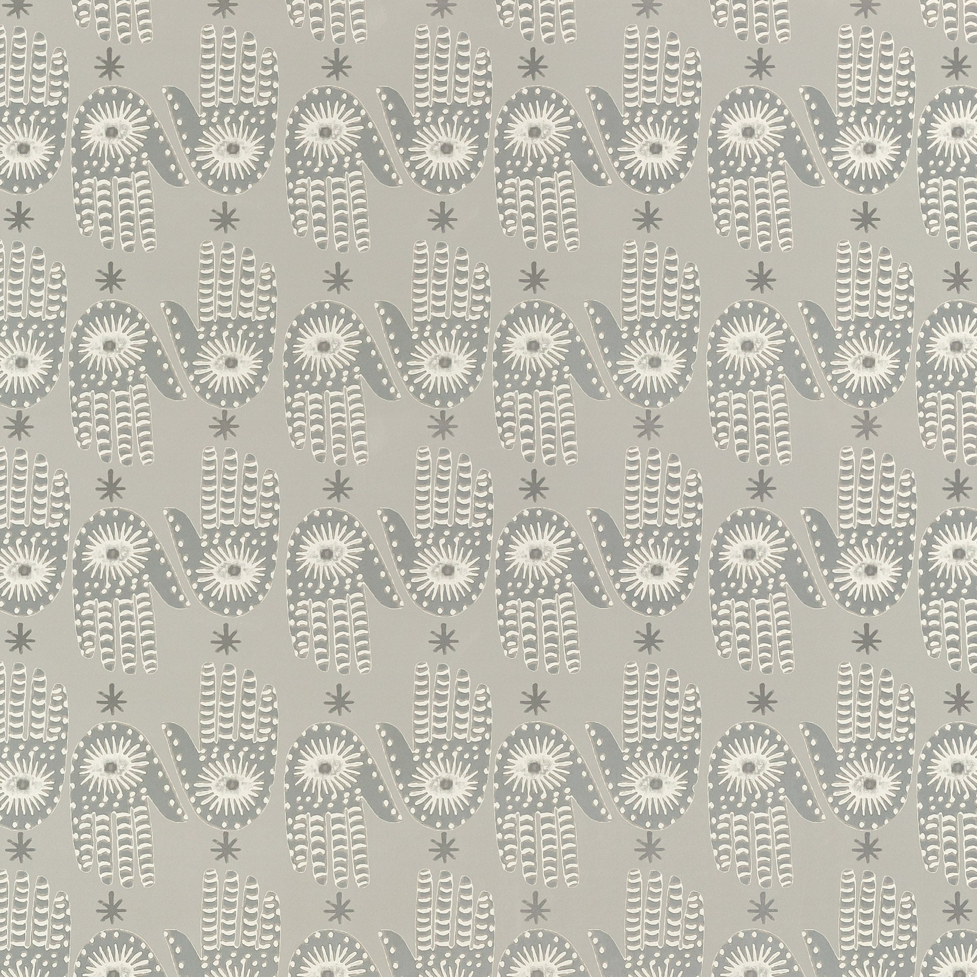 Detail of wallpaper in a playful hamsa hand print in cream and gray on a tan field.
