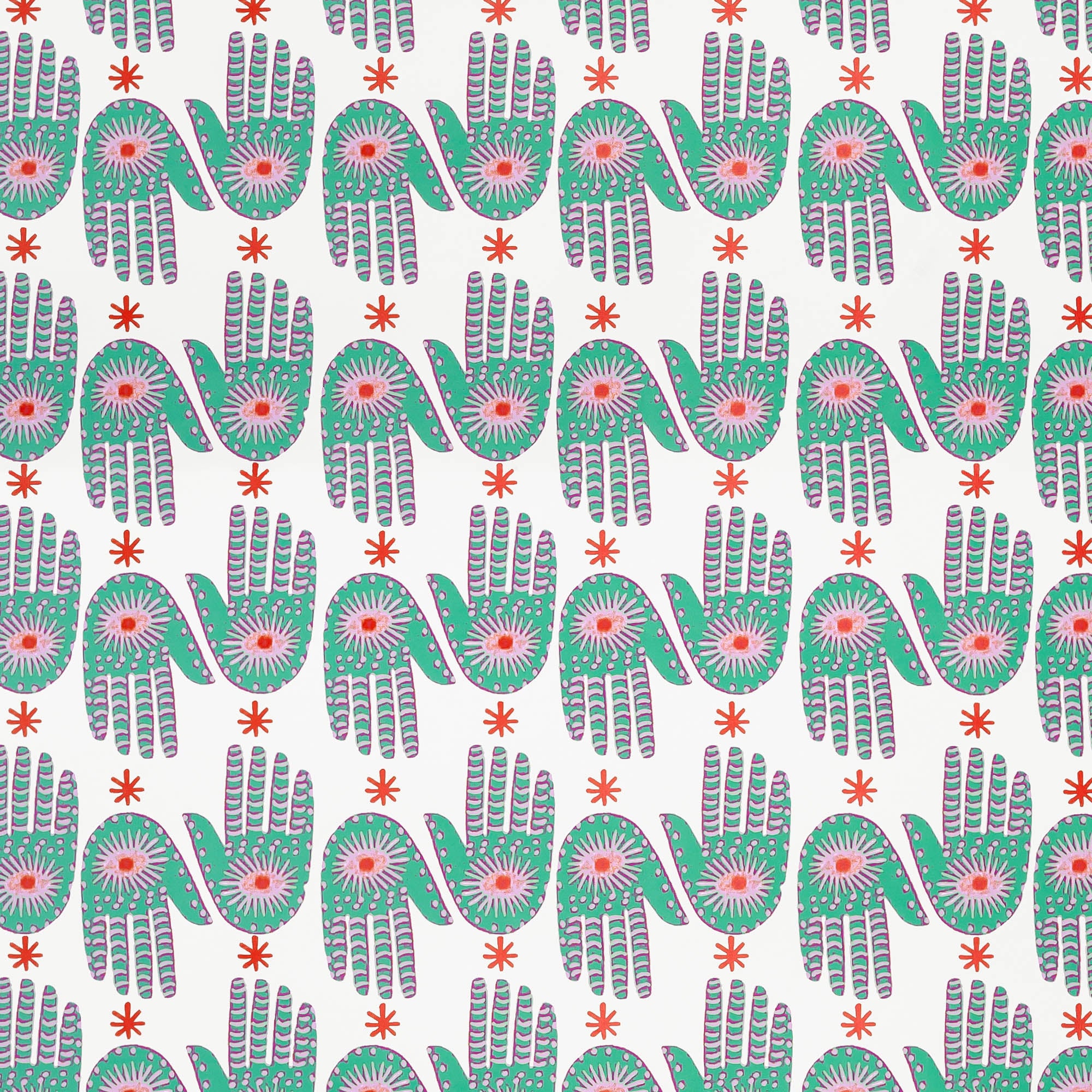 Detail of wallpaper in a playful hamsa hand print in green, pink and red on a white field.