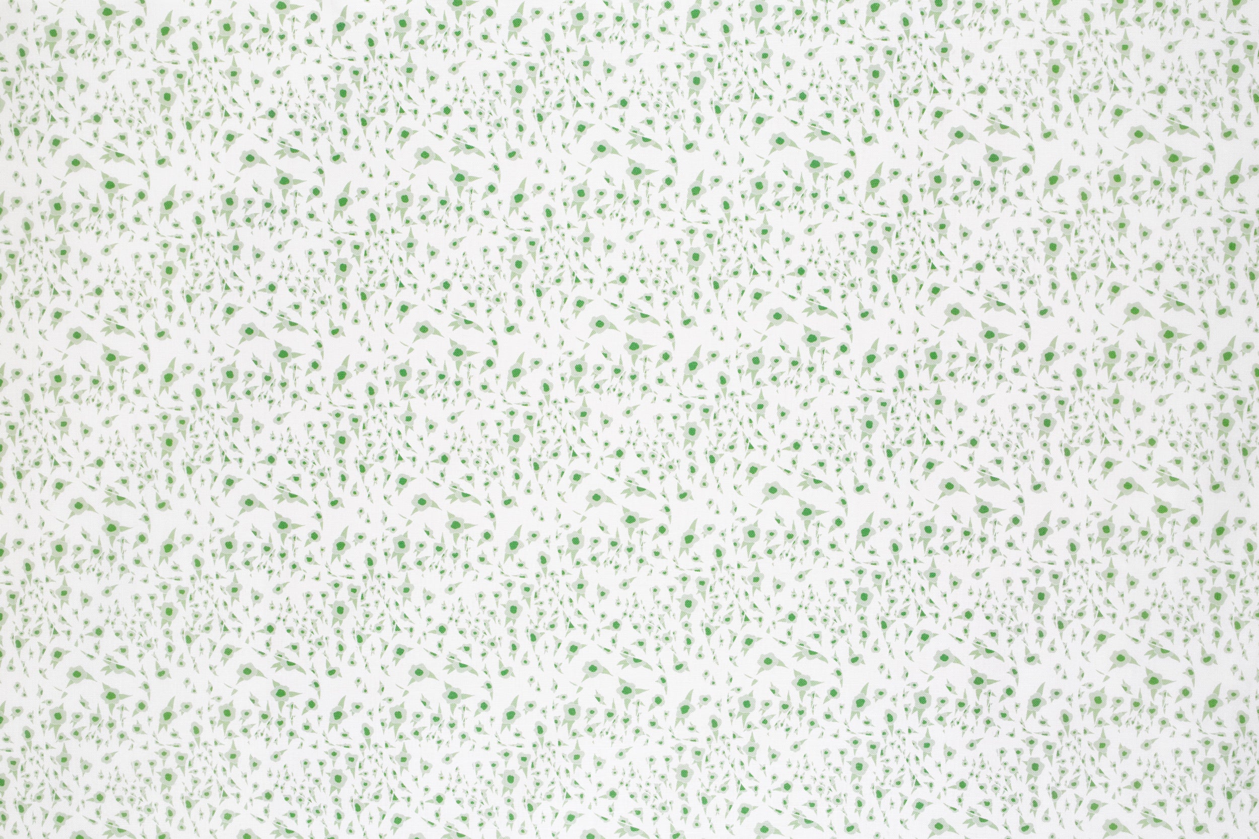 Detail of fabric in a small-scale floral pattern in green and gray on a cream field.
