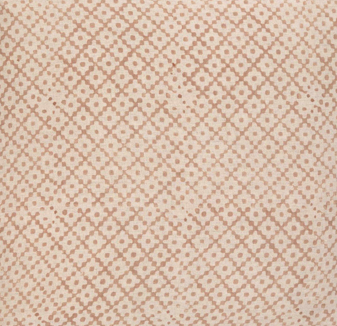 Detail of fabric in a diamond lattice print in tan on a cream field.