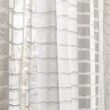 Draped sheer fabric in a wavy stripe pattern in ivory.