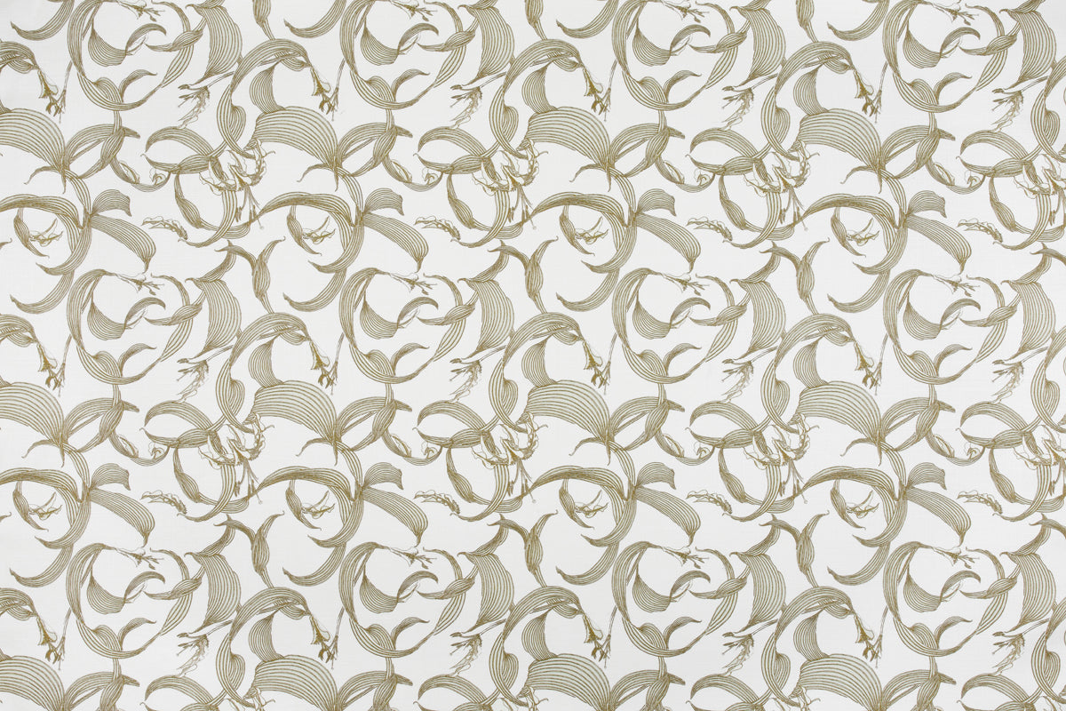 Detail of fabric in an abstract floral print in shades of tan on a cream field.