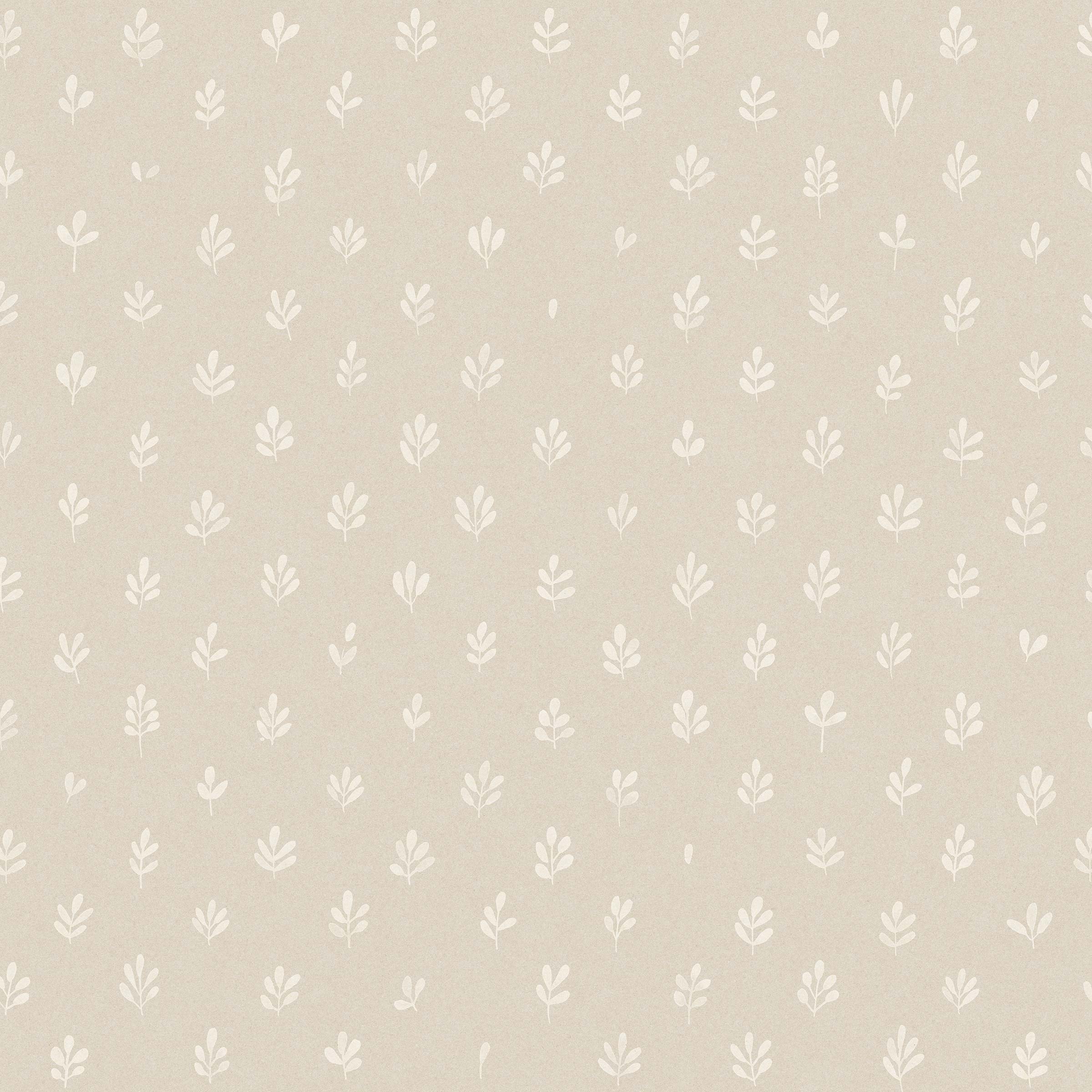 Detail of wallpaper in a repeating leaf print in white on a cream field.