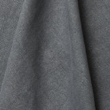 A draped swatch of old-world linen fabric in a solid dark gray color.
