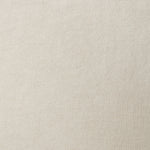 A swatch of old-world linen fabric in a solid cream color.