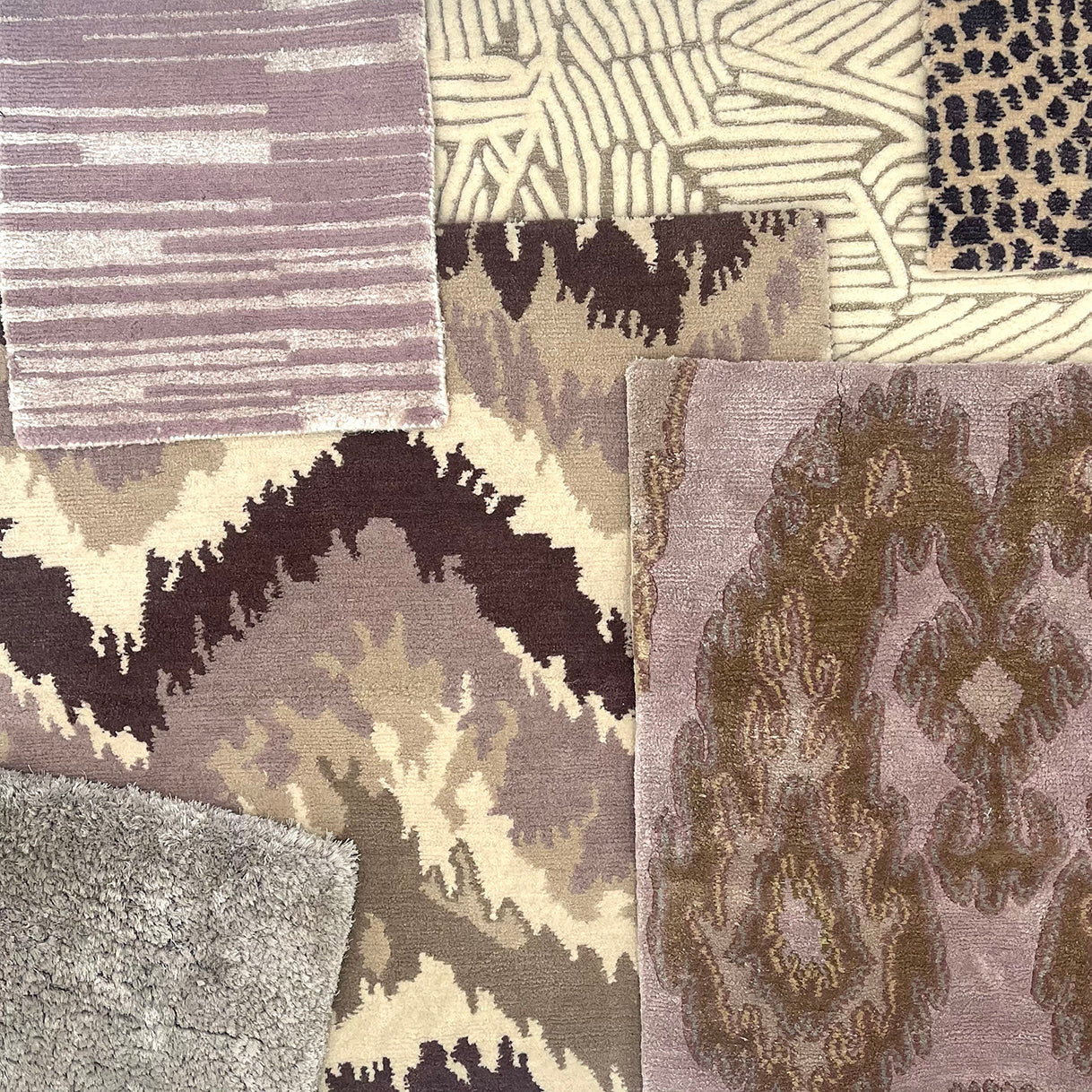 A pile of custom rug samples, in a range of patterns in a platte of light purple, taupe, brown and ream