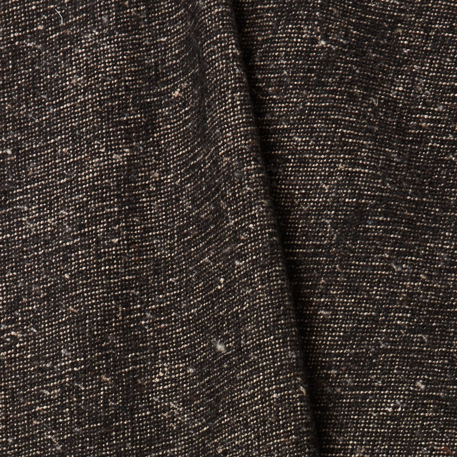 A draped swatch of blended linen-wool mix fabric in a flecked black color.