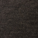 A swatch of blended linen-wool mix fabric in a flecked black color.