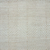 Detail of a handwoven rug in a chevron pattern in natural raffia and ivory yarn