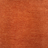 Detail of a handtufted orange rug with a subtle ribbed stripe