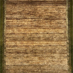 Detail of a handknotted rug with a brown field and green borders.