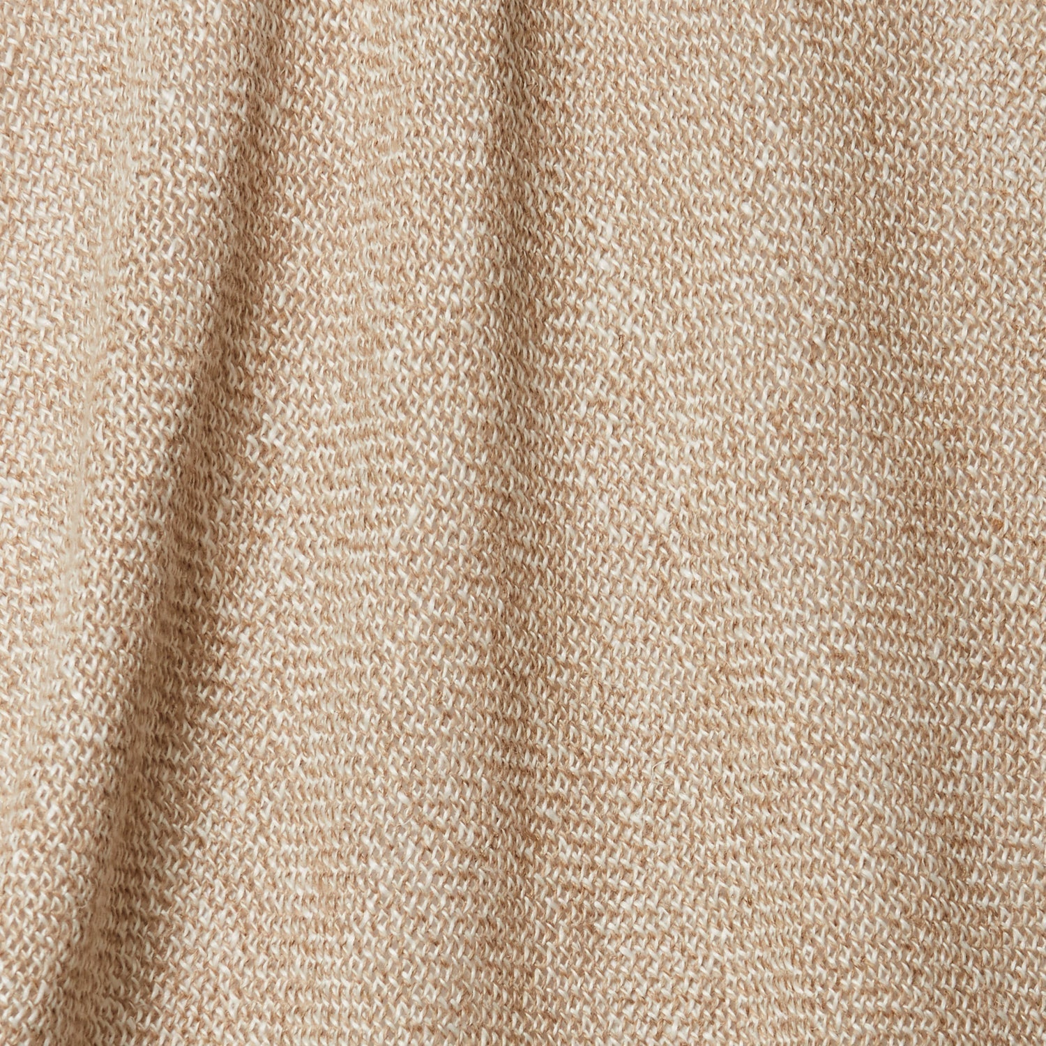 A draped swatch of open-weave sheer interior fabric in a beige color.