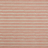 Swatch of fabric with rows of hand-drawn red and peach honeycomb shapes on a tan background.