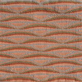 Detail of handwoven rug in a wavy striped pattern in shades of orange